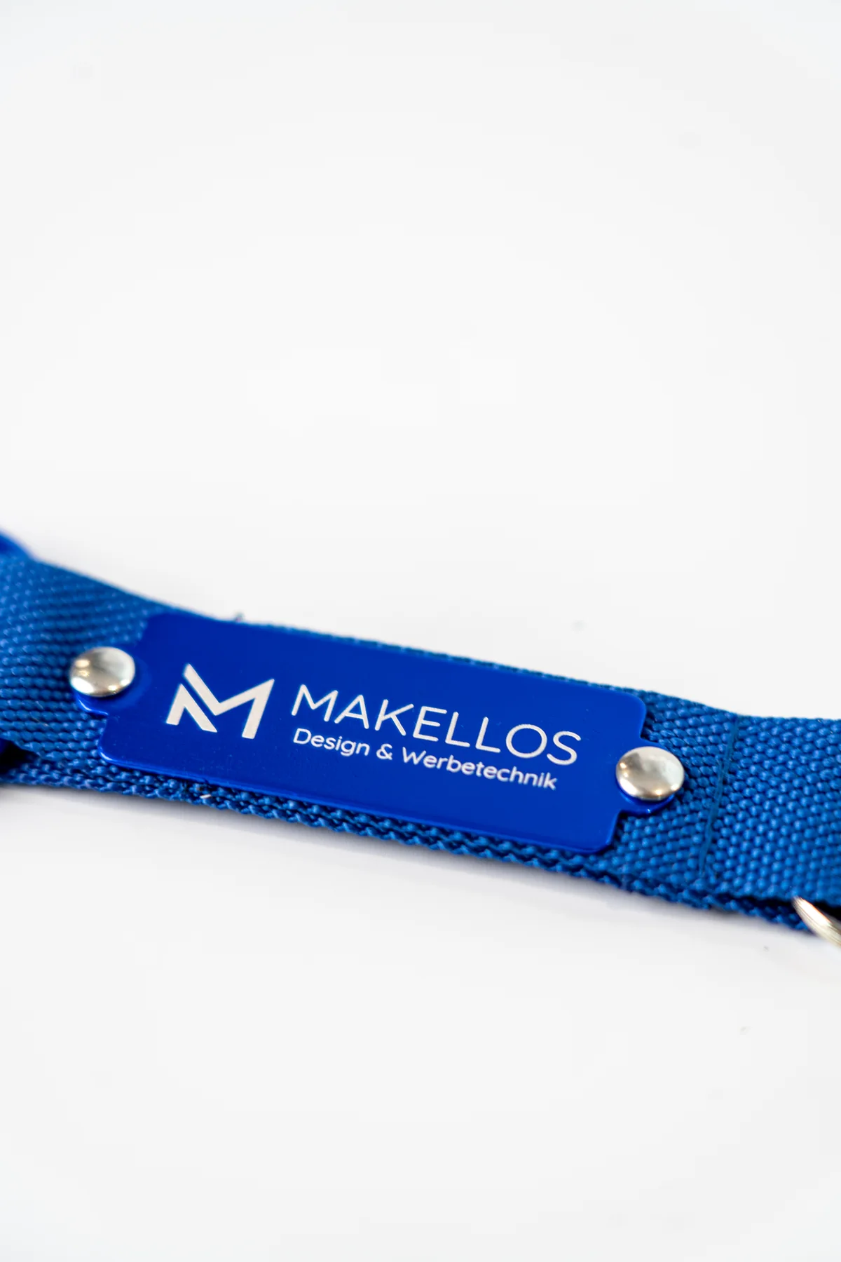 Blaues Schlüsselband mit Makellos Branding